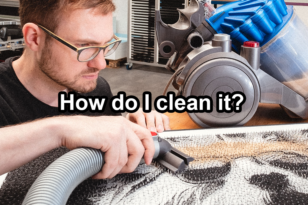 Cleaning a string art picture from dust with a vacuum cleaner